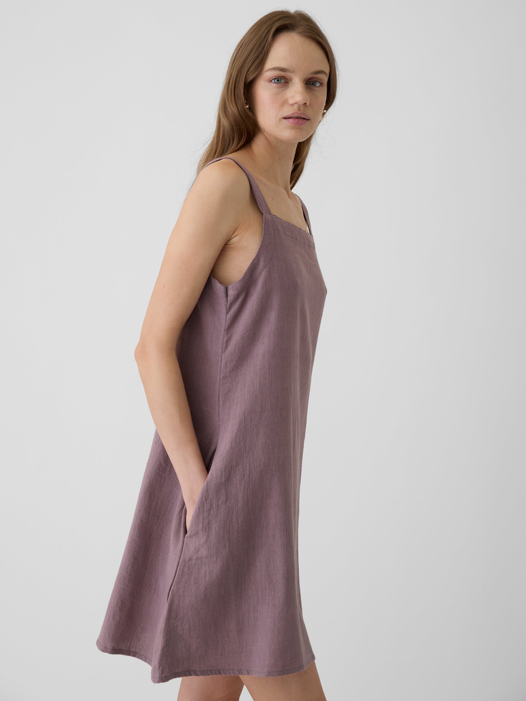 Woman wearing a mauve short dress left